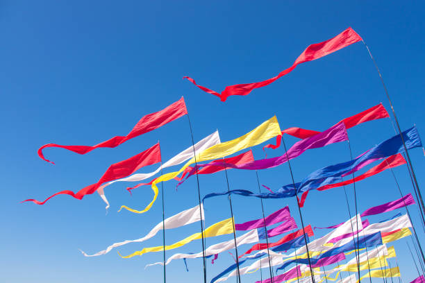 istock Multicolored kites in the blue sunny sky 1157985648