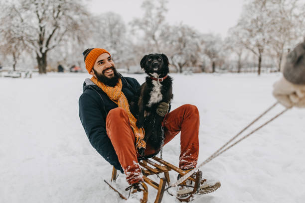 Man and his dog in snow