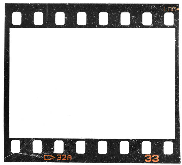Real and original 35mm or 135 film material or photo frame on white background, 35mm filmstrip with empty window or cell with dust and scratches stock photo