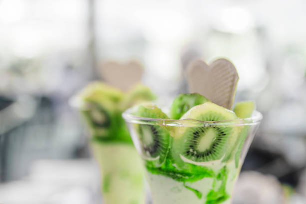 Kiwi fruit ice cream on the table in glass cups