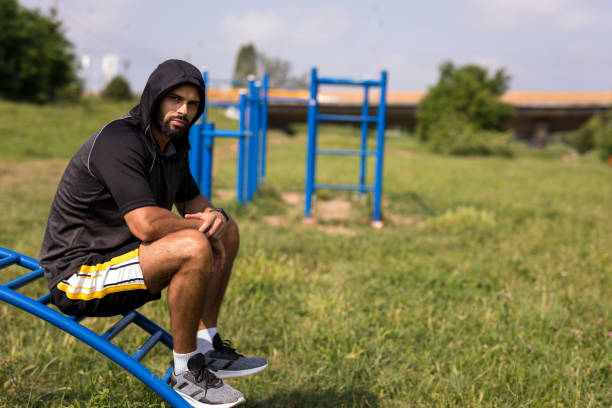 Man takes a break during morning exercise