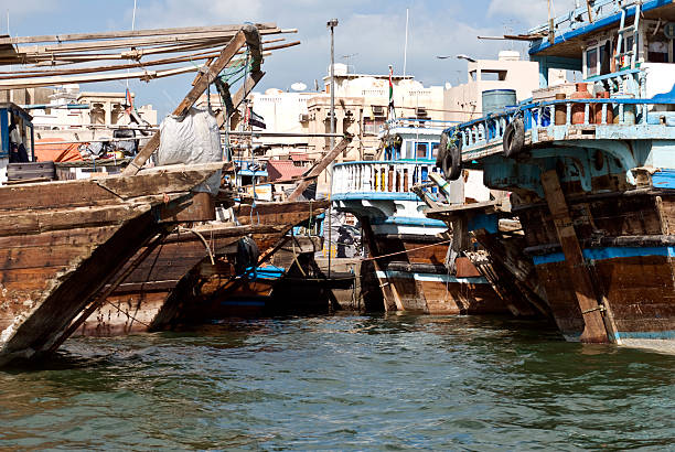 Traditional Dhows Traditional Dhows, Dubai Creek, Dubai, United Arab Emirates. arabian peninsula stock pictures, royalty-free photos & images