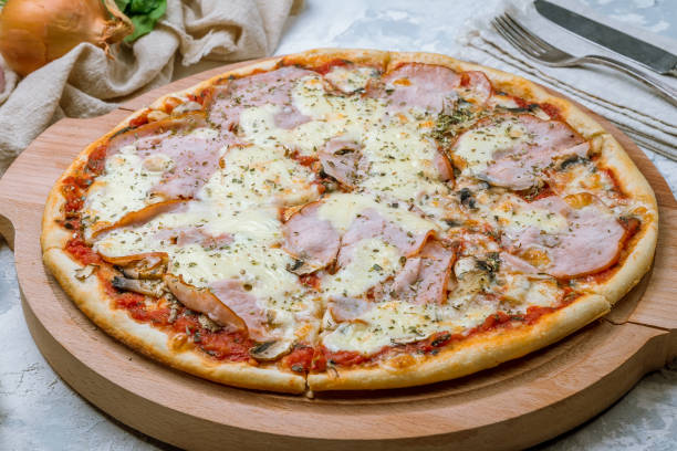 istock Pizza with ham and mushrooms 1157988692