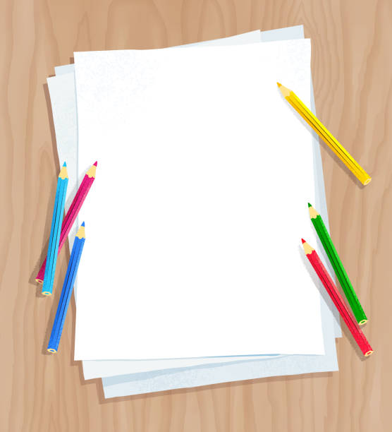 White paper on with color pencils Top view vector illustration of white paper on wooden desk background with color pencils. desk backgrounds stock illustrations