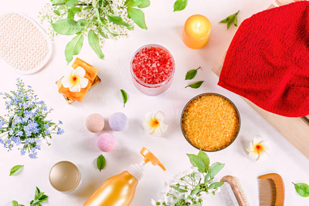 istock Spa and bath accessories with bath salts and beauty treatment products on white table. Wellness concept 1157989749