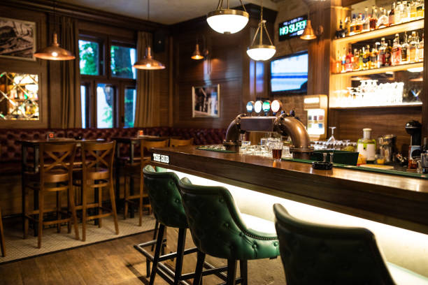 Interior of Irish pub Interior of wooden retro pub with chairs, tables and other furniture, without people irish culture stock pictures, royalty-free photos & images