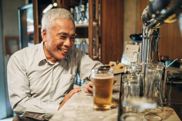 istock Senior man in the pub 1157990662