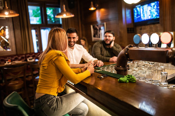 istock Modern people sitting at bar counter 1157991047