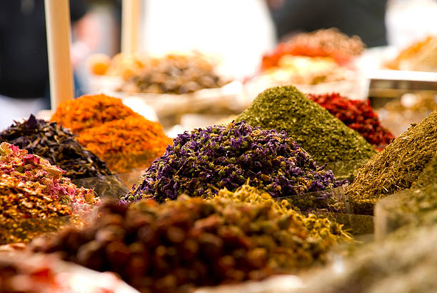 Bags of colorful spices for sale at the Souq Bags of spice at the market, Deira, Dubai, United Arab Emirates. saffron plant stock pictures, royalty-free photos & images