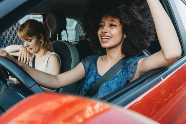 istock Two friends together in the car 1157992494