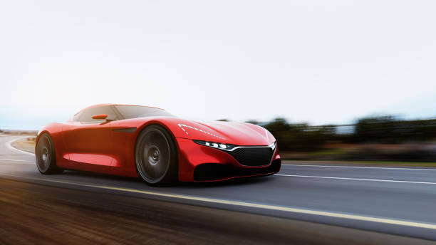 istock red car driving on a mountain road 1157993238