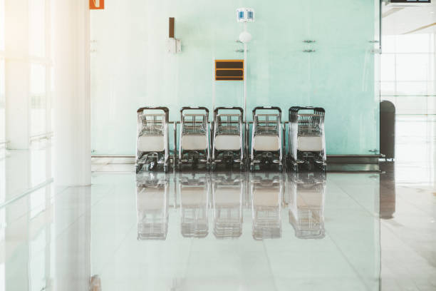 istock Rows of baggage carts indoors 1157997629