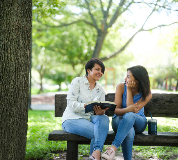 istock Mother studying the Bible with daughter 1158001016