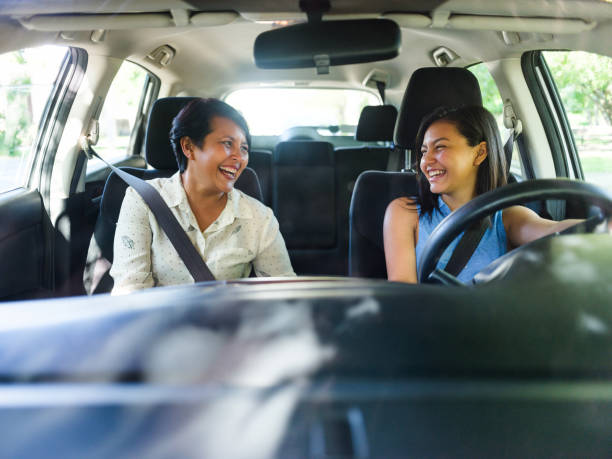 istock Happy mother and daughter in a car 1158001048
