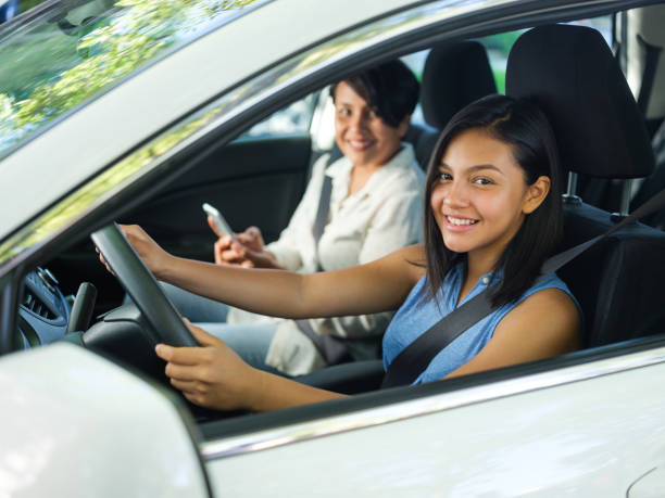istock Teenage girl learning how to drive 1158001076