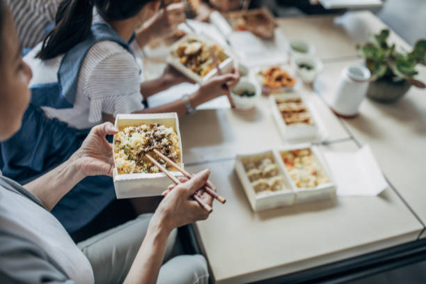 istock Happy family having meal 1158003103