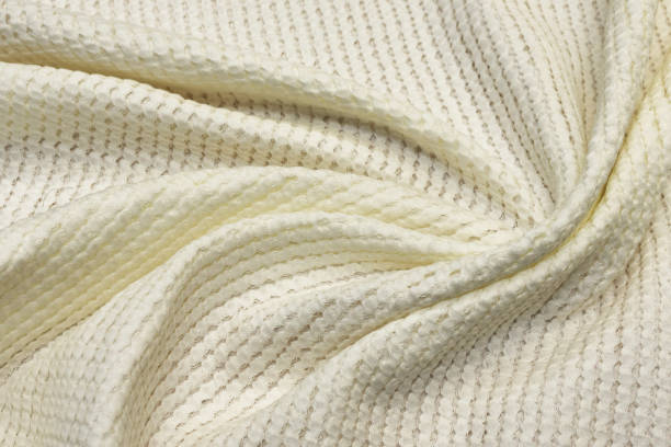 istock Cotton fabric matlasse ivory in the artistic layout. Texture, background, pattern. 1158006223