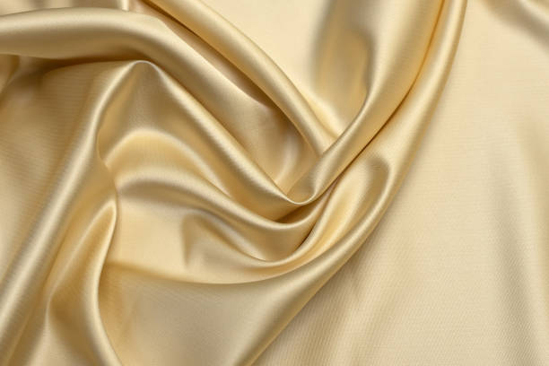istock Milk-colored taffeta silk fabric artistic layout. Texture, background. template. 1158006282