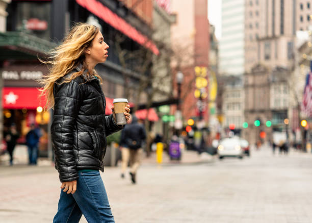 istock Crossing the street with a coffee 1158008362
