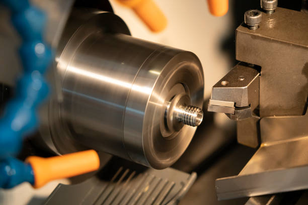 istock The CNC lathe machine cutting the thread at the steel shaft. 1158010270
