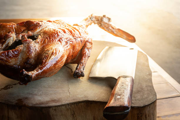 istock whole roasted duck placed on chopping wood 1158011136