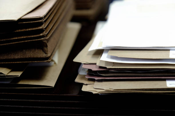 istock Files and Folders on Desk Work Busy Information working 1158012644
