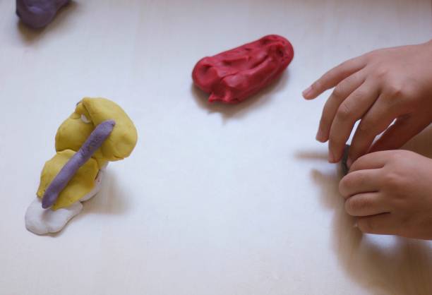 istock child playing with play dough 1158012660