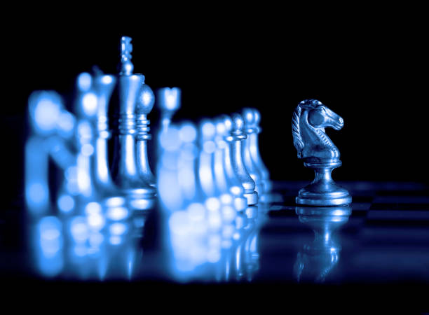 istock Pieces on chess board for playing game and strategy knight kingdom gaming 1158012703