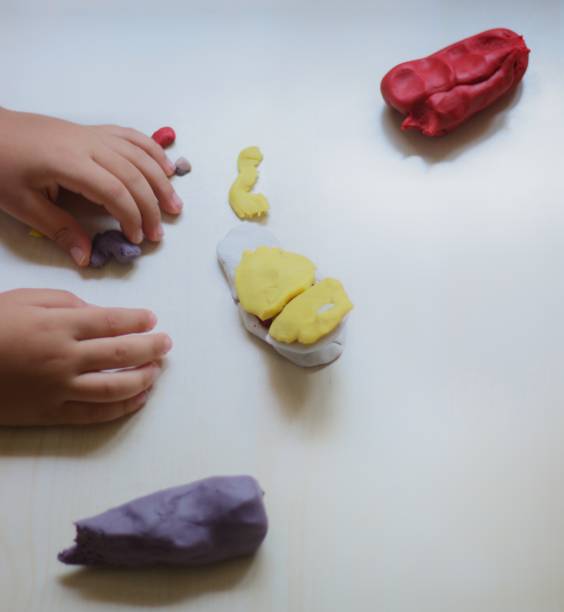 istock child playing with play dough 1158013332
