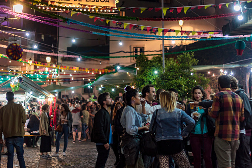 LISBON, PORTUGAL - JUNE 21, 2018: People in Lisbon street during popular saints festival