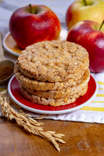 istock Round rice crackers made with apple and cinnamon, healthy snack for breakfast, lunch and school food 1158015932