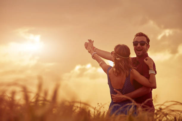 istock Couple in sunset / sunrise time in a wheat field. 1158016554