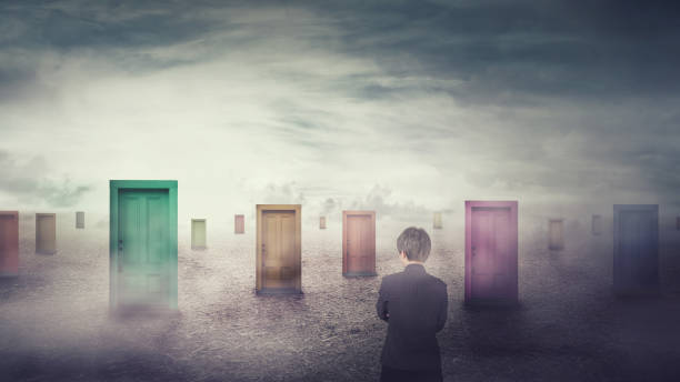 istock Businesswoman in front of many different doors choosing one. Difficult decision, important choice concept, failure or success. Ways to unknown future 1158018025