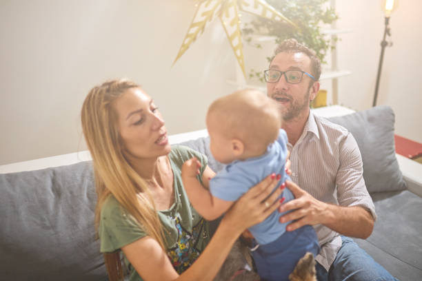 istock Parents playing with a baby at home. 1158019214
