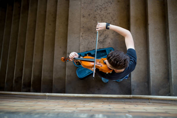 istock Street musician playing violin 1158019229