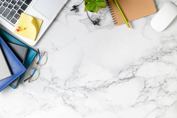 istock Modern marble desk table with laptop, other supplies 1158020946