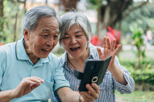 istock Happy senior couple using phone for video call 1158020954