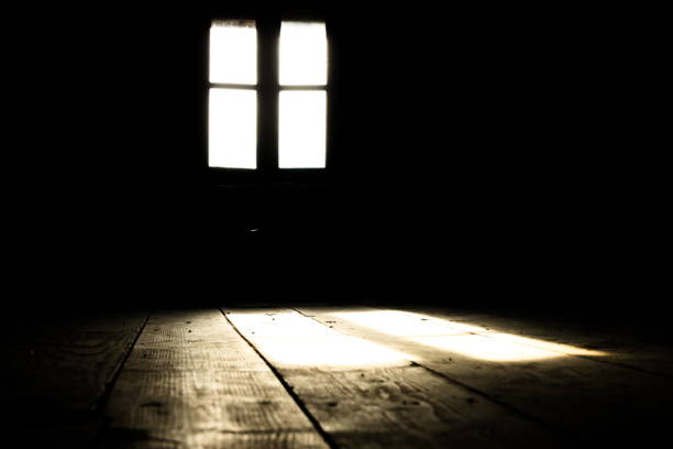 istock Low angle of Back lit Window on Wall in Darkroom 1158021058