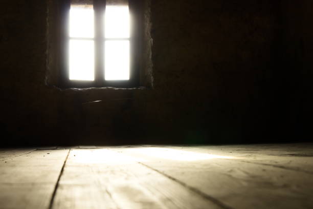 istock Low angle of Back lit Window on Wall in Darkroom 1158021060