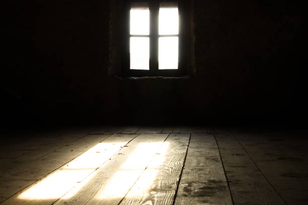 istock Low angle of Back lit Window on Wall in Darkroom 1158021067