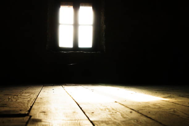 istock Low angle of Back lit Window on Wall in Darkroom 1158021068