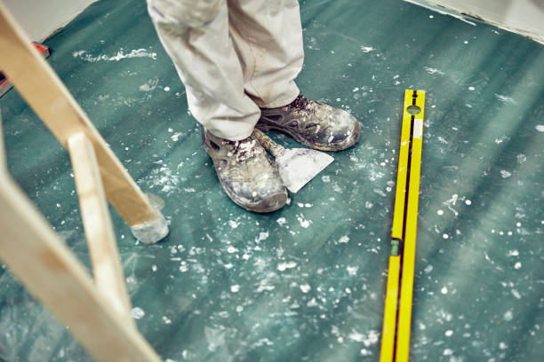 istock Worker with tools renovating house in real environment. 1158021292