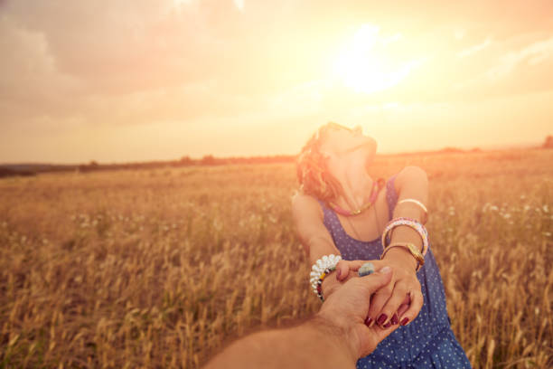 istock Young couple enjoying in a wheat field. 1158021348