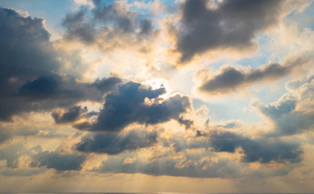 istock The sun light passes through the clouds at sunset. 1158022940