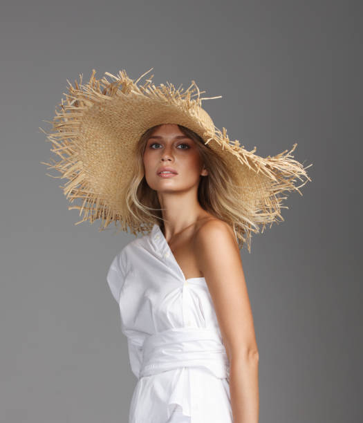 istock Beautiful woman wearing straw hat 1158023737
