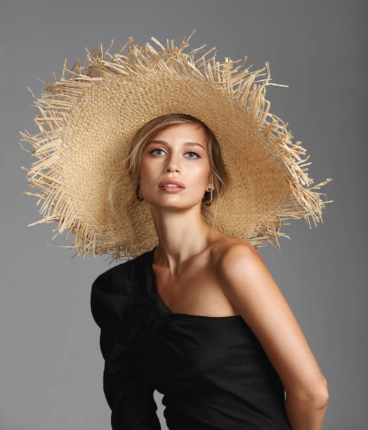 istock Beautiful woman wearing straw hat 1158023756