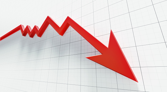 Red arrow symbol forming a line graph over a graph paper background.  Low angle view. Horizontal composition with copy space.