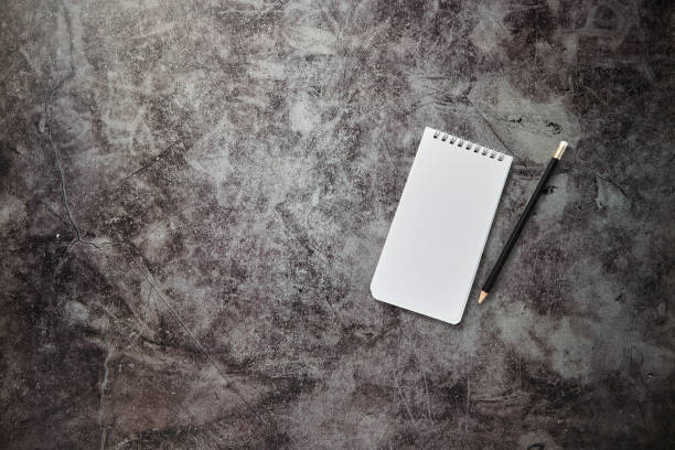 istock Office desk table Blank note book and pencil 1158025750