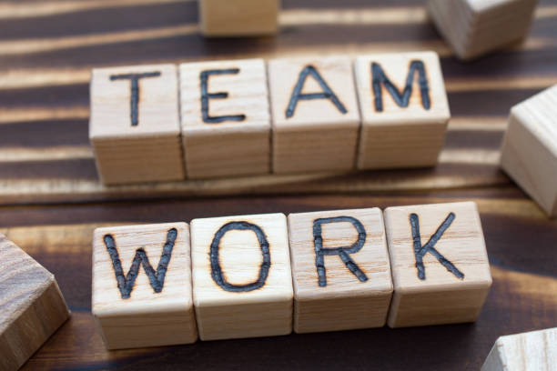 istock inscription team work wooden cubes 1158025758