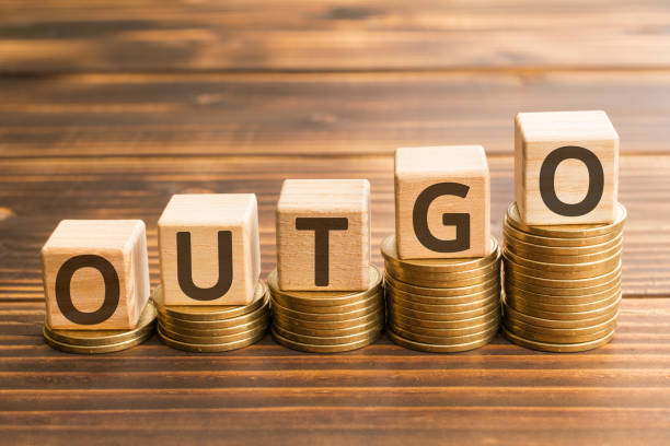 istock inscription outgo wooden cubes 1158025791